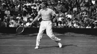Gottfried von Cramm Swings Tennis Racket at Tournament