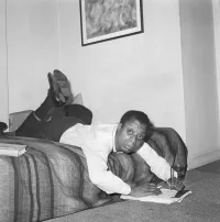 James Baldwin Writing on his Bed