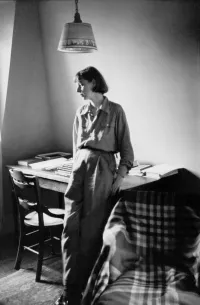 Carson McCullers Looking Pensively Leaning Against Desk