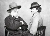 Walt Whitman and Peter Doyle Sitting in Chairs Looking at Each Other