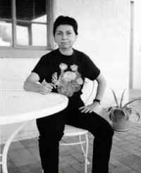 Gloria E. Anzaldúa Sitting on a Patio