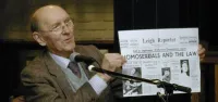 Allan Horsfall Holding Up Leigh Reporter Newspaper With Homosxuals and the Law Headline