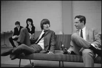George Harrison and Brian Epstein Sitting on a Bench