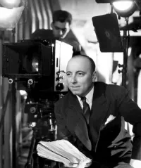 Marcel Carné on the Set Holding His Film Script