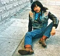 Martin Wong Sitting on the Concrete Outdoors
