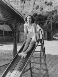 Ona Munson on a Kids Playground Slide