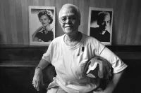 Stormé DeLarverie in 1994 Between Pictures of Herself Prior to Doing Drag and During the Stonewall Rebellion of 1969