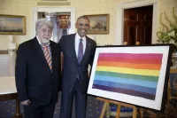 Gilbert Baker Presents Then President Barack Obama With an Original Hand-Dyed Pride Flag at the White House