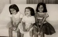 Jyotsna, Urvashi, and Rachna Vaid Wearing Dresses Sitting on a Couch in 1965