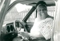 Miss Major Griffin-Gracy Smiles in a Van Driver's Seat